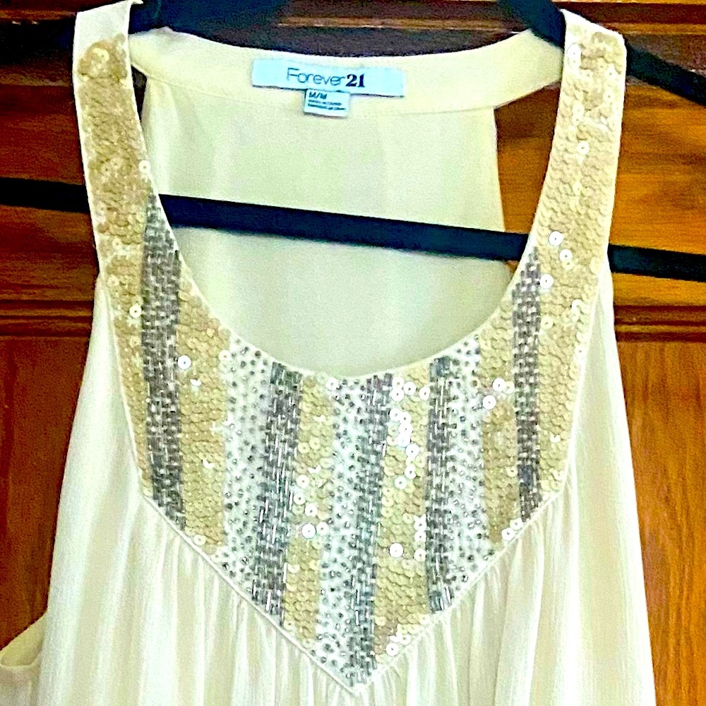 Ivory sleeveless dress with gold sequin bib